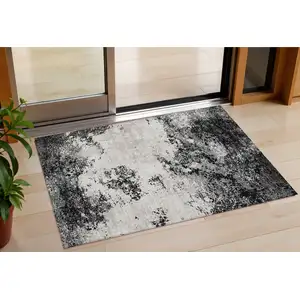Photo of Black Gray And Ivory Abstract Washable Indoor Outdoor Area Rug