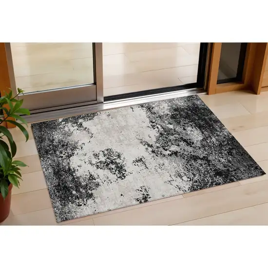 Black Gray And Ivory Abstract Washable Indoor Outdoor Area Rug Photo 1