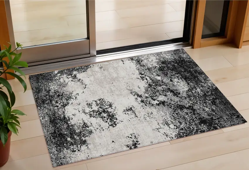 Black Gray And Ivory Abstract Washable Indoor Outdoor Area Rug Photo 1