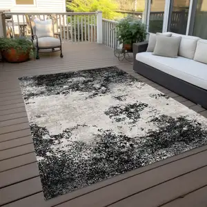 Photo of Black Gray And Ivory Abstract Washable Indoor Outdoor Area Rug