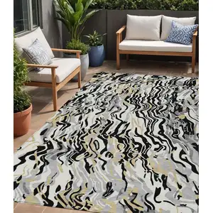 Photo of Black Gray And Ivory Abstract Washable Indoor Outdoor Area Rug