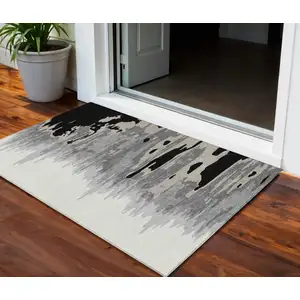 Photo of Black Gray And Ivory Abstract Washable Indoor Outdoor Area Rug