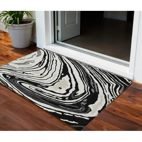 Black Gray And Ivory Abstract Washable Indoor Outdoor Area Rug Photo 1
