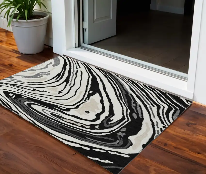 Black Gray And Ivory Abstract Washable Indoor Outdoor Area Rug Photo 1