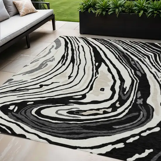 Black Gray And Ivory Abstract Washable Indoor Outdoor Area Rug Photo 1