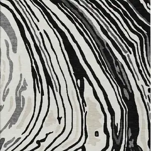 Photo of Black Gray And Ivory Abstract Washable Indoor Outdoor Area Rug