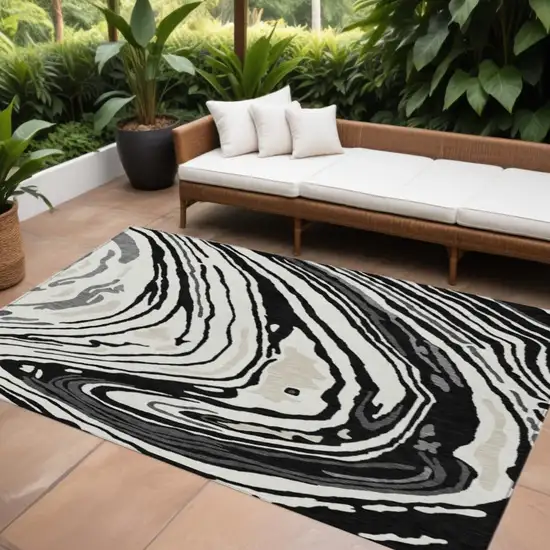 Black Gray And Ivory Abstract Washable Indoor Outdoor Area Rug Photo 1