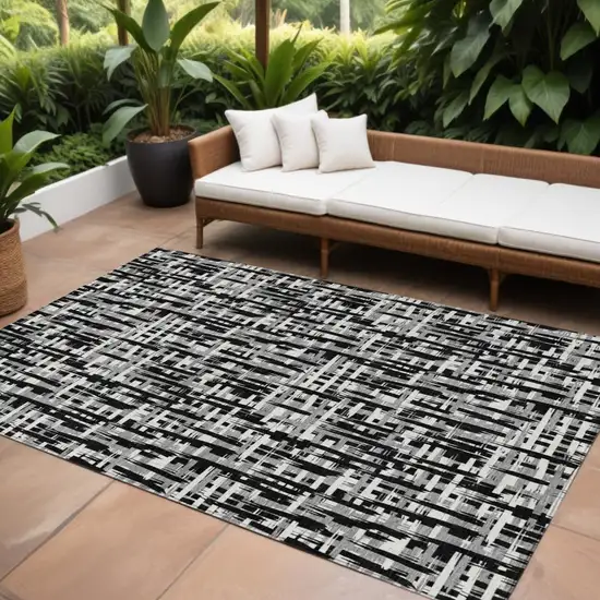 Black Gray And Ivory Abstract Washable Indoor Outdoor Area Rug Photo 1