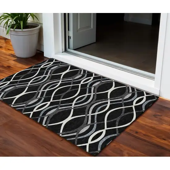 Black Gray And Ivory Abstract Washable Indoor Outdoor Area Rug Photo 1