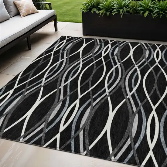 Black Gray And Ivory Abstract Washable Indoor Outdoor Area Rug Photo 1