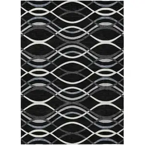 Photo of Black Gray And Ivory Abstract Washable Indoor Outdoor Area Rug