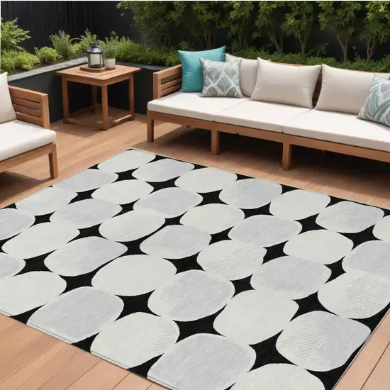 Black Gray And Ivory Abstract Washable Indoor Outdoor Area Rug Photo 1