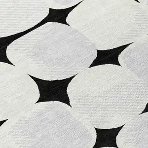Photo of Black Gray And Ivory Abstract Washable Indoor Outdoor Area Rug