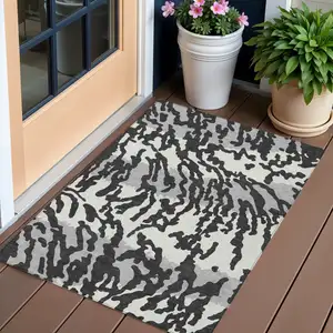Photo of Black Gray And Ivory Animal Print Washable Indoor Outdoor Area Rug
