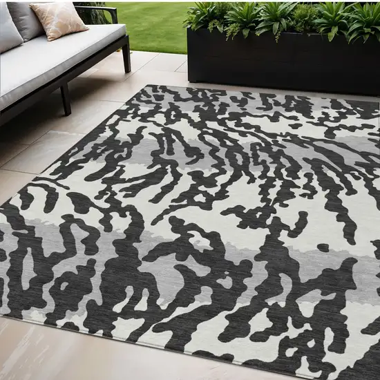Black Gray And Ivory Animal Print Washable Indoor Outdoor Area Rug Photo 1