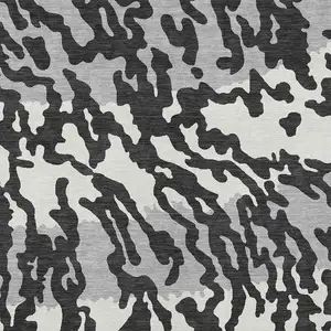 Photo of Black Gray And Ivory Animal Print Washable Indoor Outdoor Area Rug