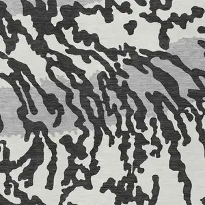 Photo of Black Gray And Ivory Animal Print Washable Indoor Outdoor Area Rug