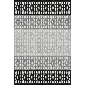 Photo of Black Gray And Ivory Geometric Washable Area Rug With UV Protection