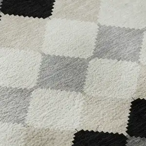 Photo of Black Gray And Ivory Geometric Washable Area Rug With UV Protection