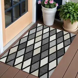 Photo of Black Gray And Ivory Geometric Washable Indoor Outdoor Area Rug