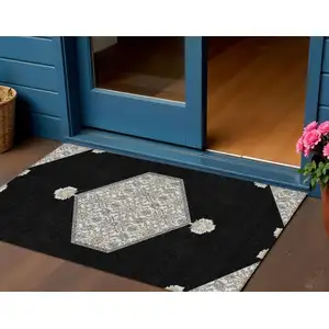 Photo of Black Gray And Ivory Oriental Washable Indoor Outdoor Area Rug