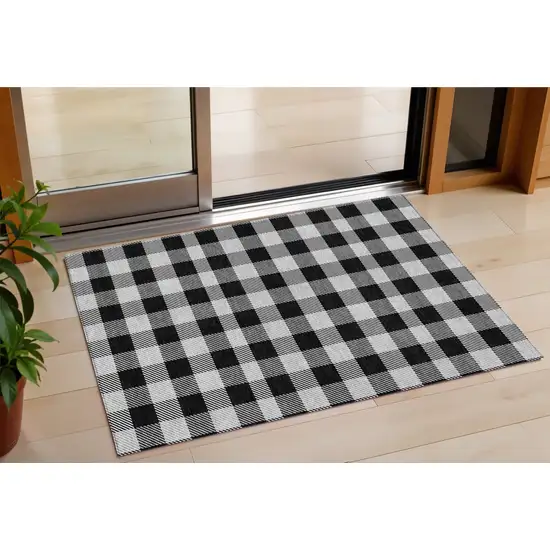 Black Gray And Ivory Plaid Washable Indoor Outdoor Area Rug Photo 1