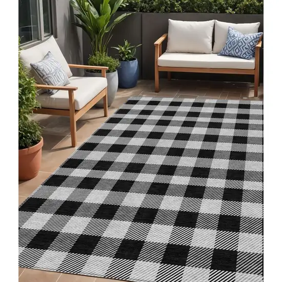 Black Gray And Ivory Plaid Washable Indoor Outdoor Area Rug Photo 1