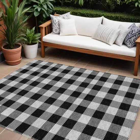 Black Gray And Ivory Plaid Washable Indoor Outdoor Area Rug Photo 1