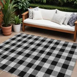 Photo of Black Gray And Ivory Plaid Washable Indoor Outdoor Area Rug