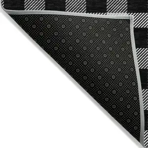 Photo of Black Gray And Ivory Plaid Washable Indoor Outdoor Area Rug