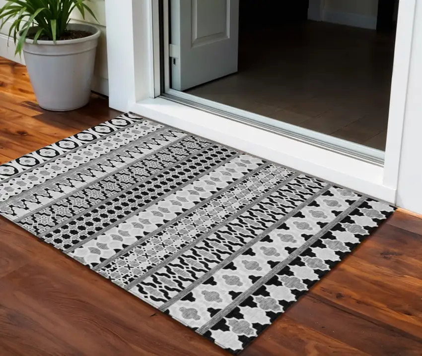 Black Gray And Ivory Quatrefoil Washable Indoor Outdoor Area Rug Photo 1