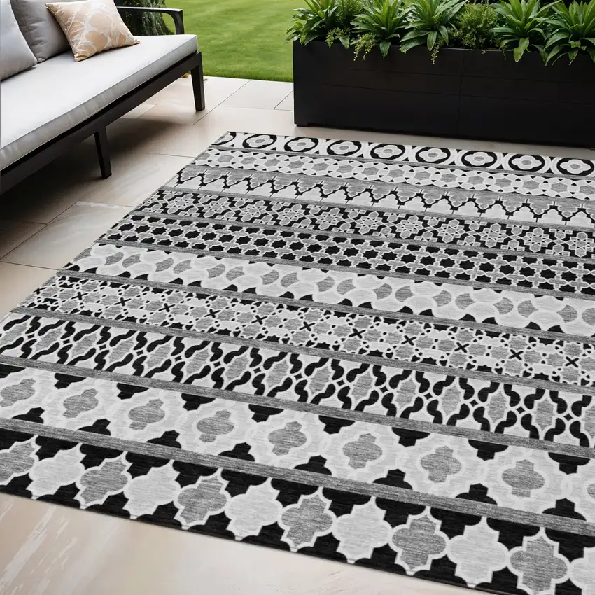 Black Gray And Ivory Quatrefoil Washable Indoor Outdoor Area Rug Photo 1