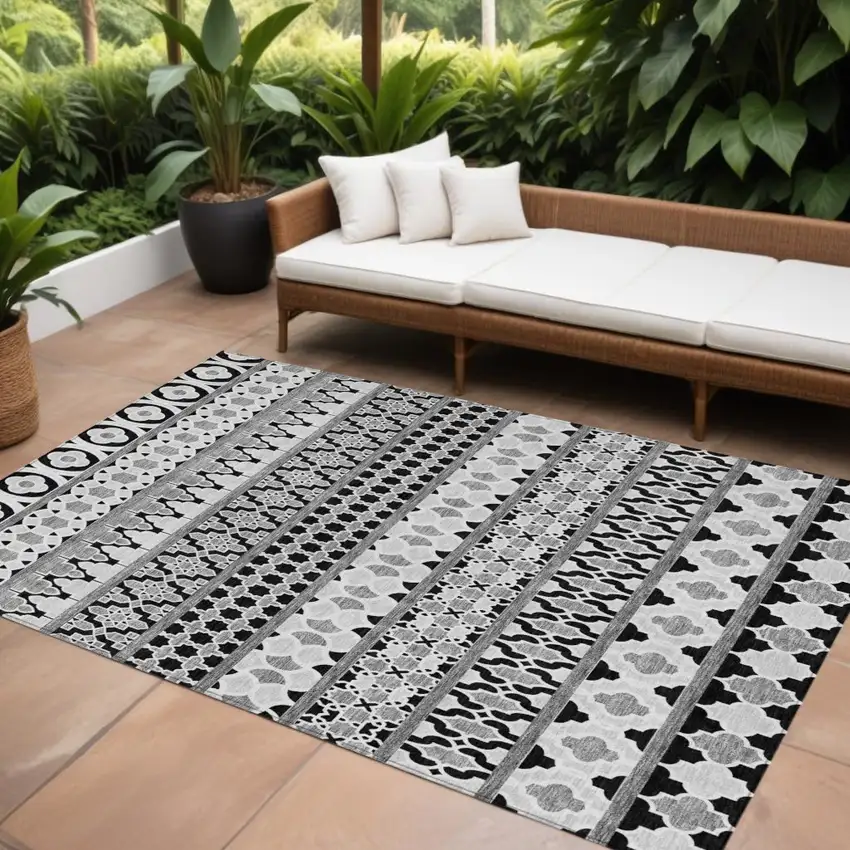 Black Gray And Ivory Quatrefoil Washable Indoor Outdoor Area Rug Photo 1