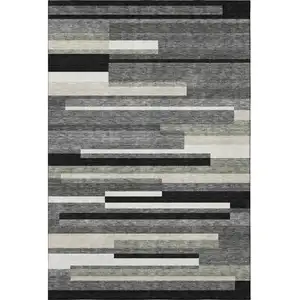 Photo of Black Gray And Ivory Striped Washable Area Rug With UV Protection