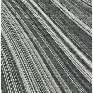 Photo of Black Gray And Ivory Striped Washable Area Rug With UV Protection