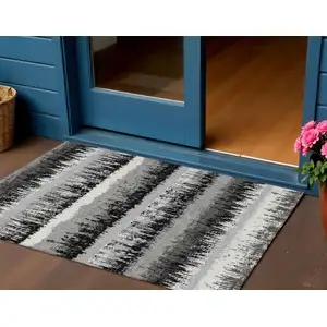 Photo of Black Gray And Ivory Striped Washable Indoor Outdoor Area Rug