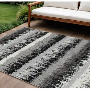 Photo of Black Gray And Ivory Striped Washable Indoor Outdoor Area Rug