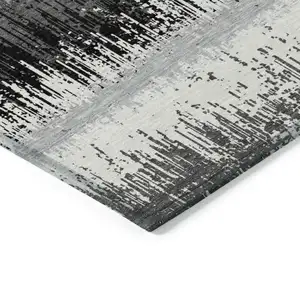 Photo of Black Gray And Ivory Striped Washable Indoor Outdoor Area Rug