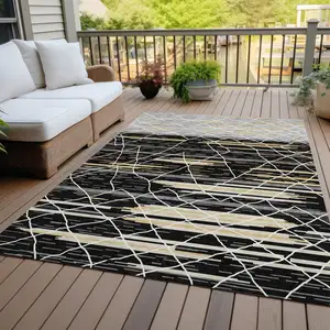 Photo of Black Gray And Ivory Striped Washable Indoor Outdoor Area Rug