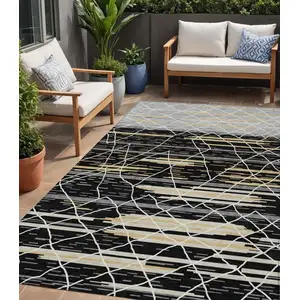 Photo of Black Gray And Ivory Striped Washable Indoor Outdoor Area Rug