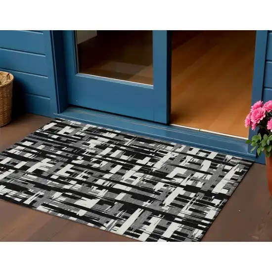 Black Gray And Ivory Striped Washable Indoor Outdoor Area Rug Photo 2
