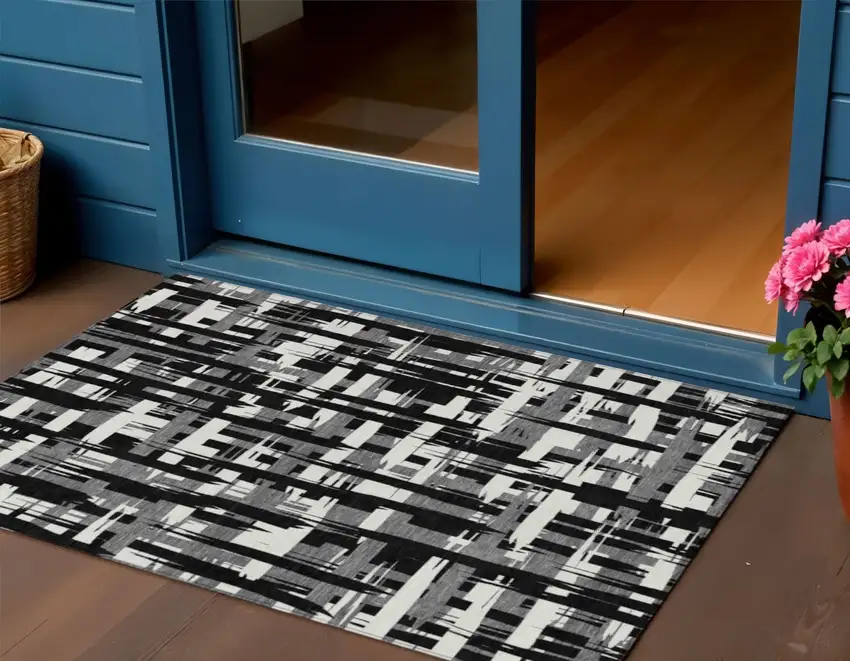 Black Gray And Ivory Striped Washable Indoor Outdoor Area Rug Photo 2
