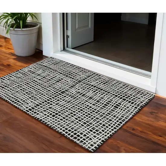 Black Gray And Ivory Striped Washable Indoor Outdoor Area Rug Photo 1
