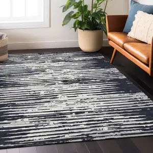 Photo of Black Gray And Ivory Striped Washable Indoor Outdoor Area Rug