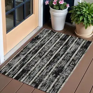 Photo of Black Gray And Ivory Striped Washable Indoor Outdoor Area Rug