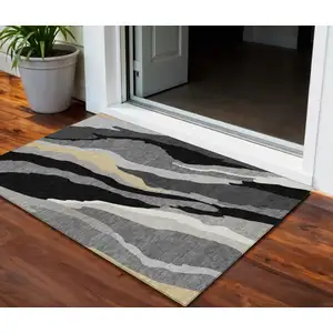 Photo of Black Gray And Tan Abstract Washable Indoor Outdoor Area Rug
