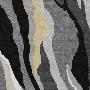 Photo of Black Gray And Tan Abstract Washable Indoor Outdoor Area Rug