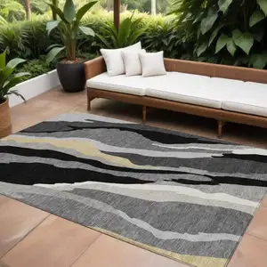 Photo of Black Gray And Tan Abstract Washable Indoor Outdoor Area Rug