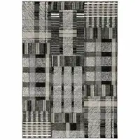 Photo of Black Grey And Ivory Geometric Power Loom Stain Resistant Area Rug