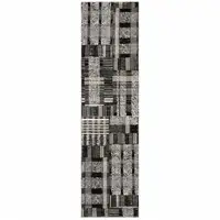 Photo of Black Grey And Ivory Geometric Power Loom Stain Resistant Runner Rug